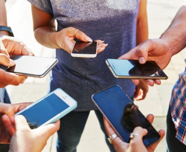 Phones held in a group