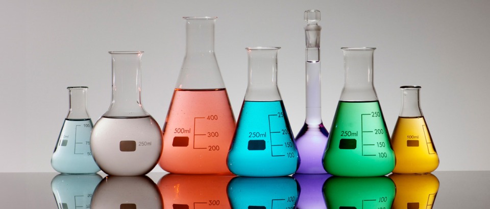 lab glassware filled with different colour liquids to suggest a wide range of research