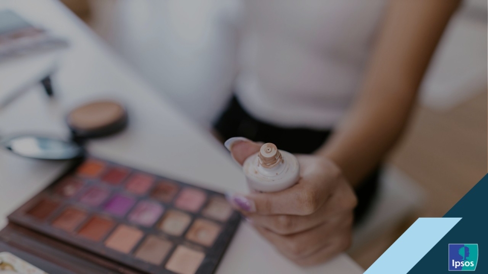 Cover page showing a young woman with a tube in hand and other make up products in front of her