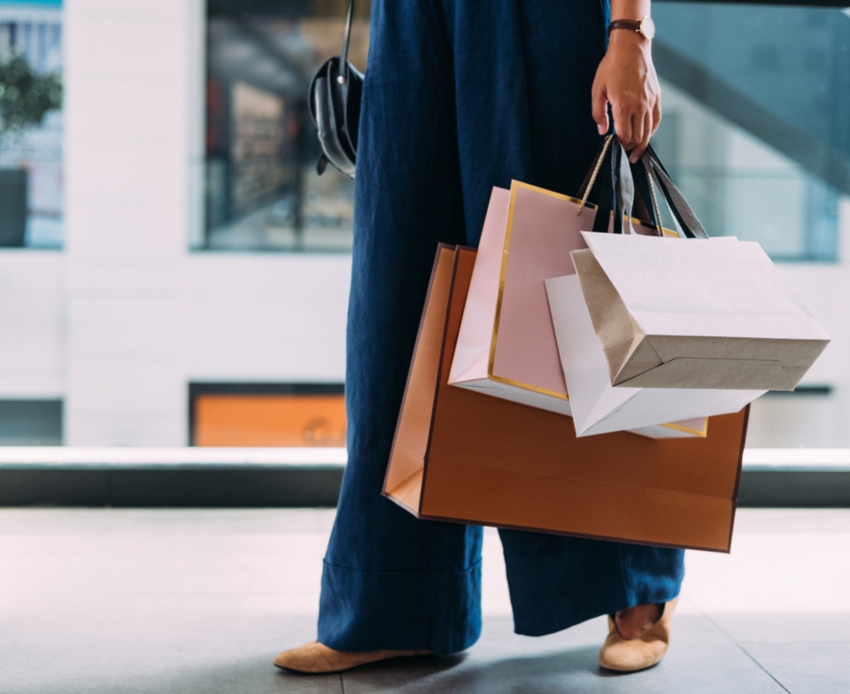 A lady with shopping bags