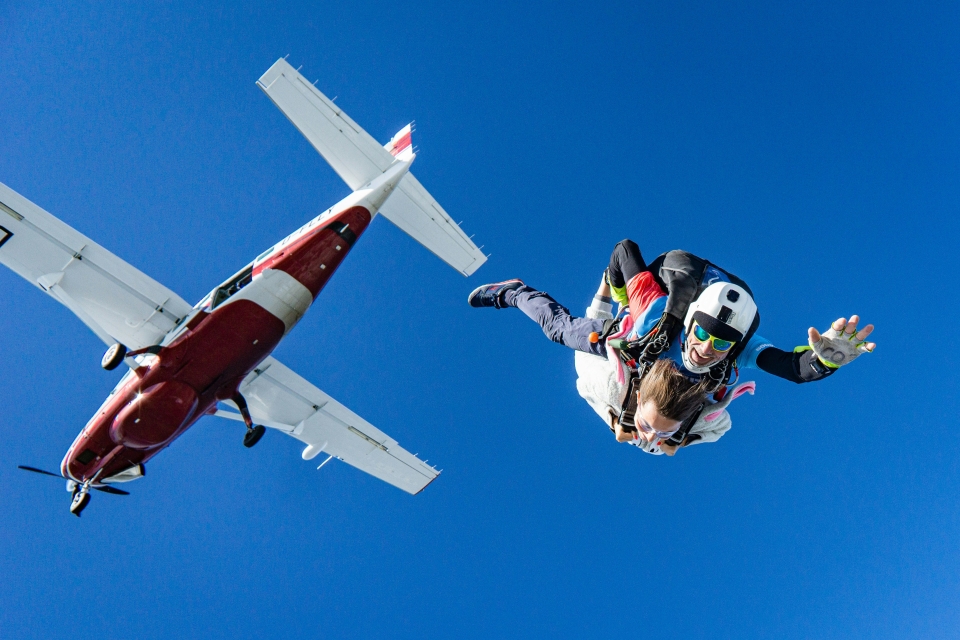 Image of someone diving out of a plane