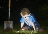 Digging boy finding treasure