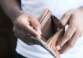 Man holding an empty wallet