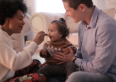 Parents feeding their child