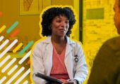 Female doctor speaking with patient