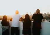 young-people-looking-over-balcony